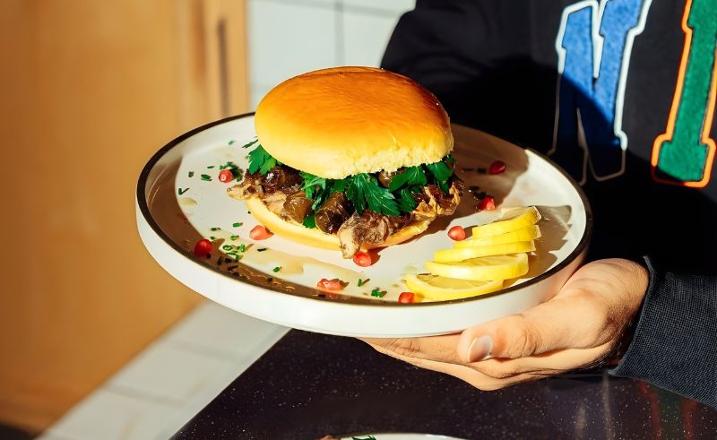 Eatopi & Mother Lina Collab on a Warak Enab Burger