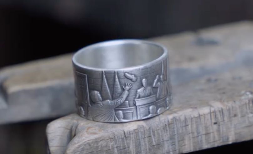 This Ring Captures the Moment a Shoe Flew at George W. Bush